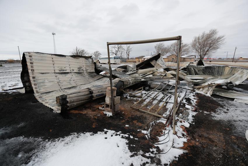 A building destroyed by fire sits in ashes in the Texas R.V. Park in Fritch, TX. Snow  and rainfall on Thursday offered temporary relief to firefighters battling the blaze but weather conditions this weekend may cause the fire to spread again.