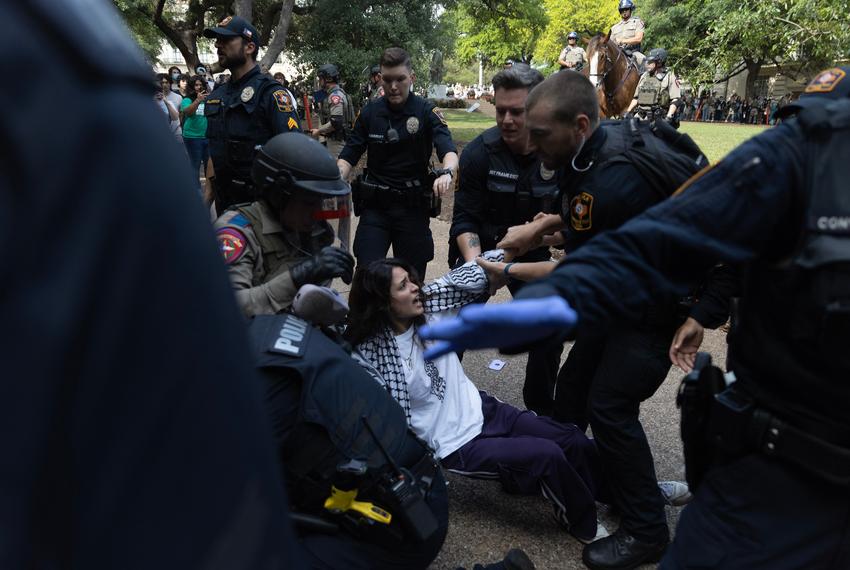 A protester is pulled from the crowd to be arrested at the University of Texas at Austin during a protest for Palestine on April 24, 2024.