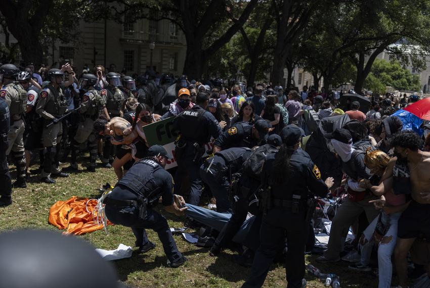 Law enforcement begins to remove demonstrators from an encampment set up in support of Palestine on UT campus Monday, April 29, 2024, in Austin.