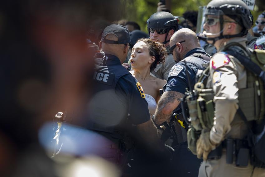 University of Texas police officers arrest a protestor within the pro-Palestinian encampment on the University of Texas at Austin campus on Monday, April 29, 2024