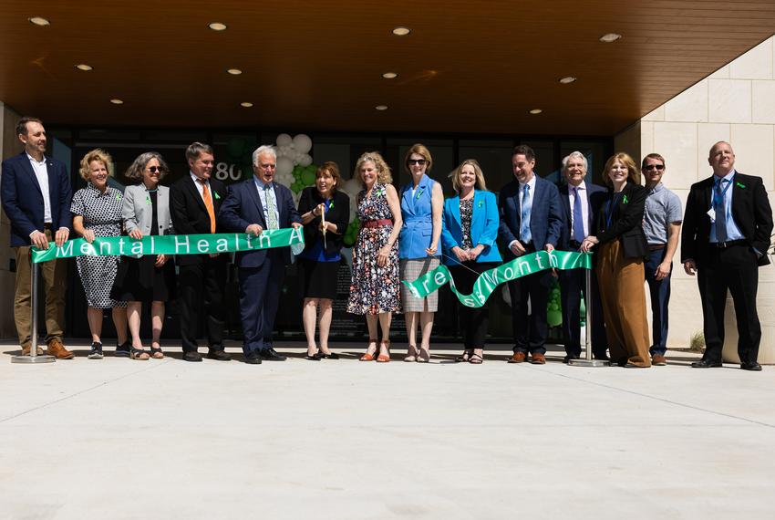 DSHS Executive Commissioner Cecile Erwin Young cuts a ribbon during the Austin State Hospital grand opening on Wednesday, May 15, 2024 in Austin. The ribbon read, “Mental Health Awareness Month” and was colored green as the international symbol for mental health awareness.
