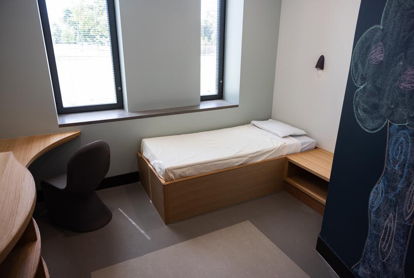 Patient rooms include a bed, desk and private bathroom in the Austin State Hospital on Wednesday, May 15, 2024 in Austin. The hospital has 240 beds for adult inpatients.
