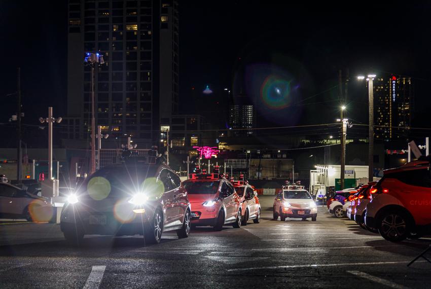 Autonomous Cruise cars line up to leave the Cruise Depot in downtown Austin on Sept. 26, 2023. Cruise, a San Francisco-based autonomous car company, is one of several autonomous driving companies that test vehicles in Austin.