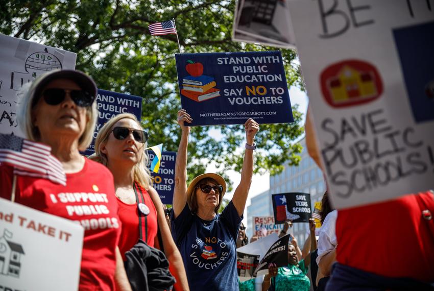 Protesters holding signs and chanting, gathering in front of the Governor's Mansion during a rally against school vouchers on Oct. 7, 2023. Hundreds gathered to protest two days before a special session was slated to begin on Oct. 9, 2023.