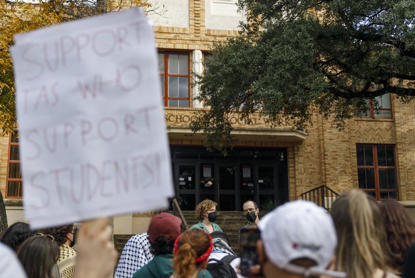 TAs Callie Kennedy, left, and Parham Daghighi, right, speak to a crowd. UT Austin students rallied at the Steve Hicks School of Social Work in a protest demanding the reinstatement of TAs Callie Kennedy and Parham Daghighi on Dec. 8, 2023.