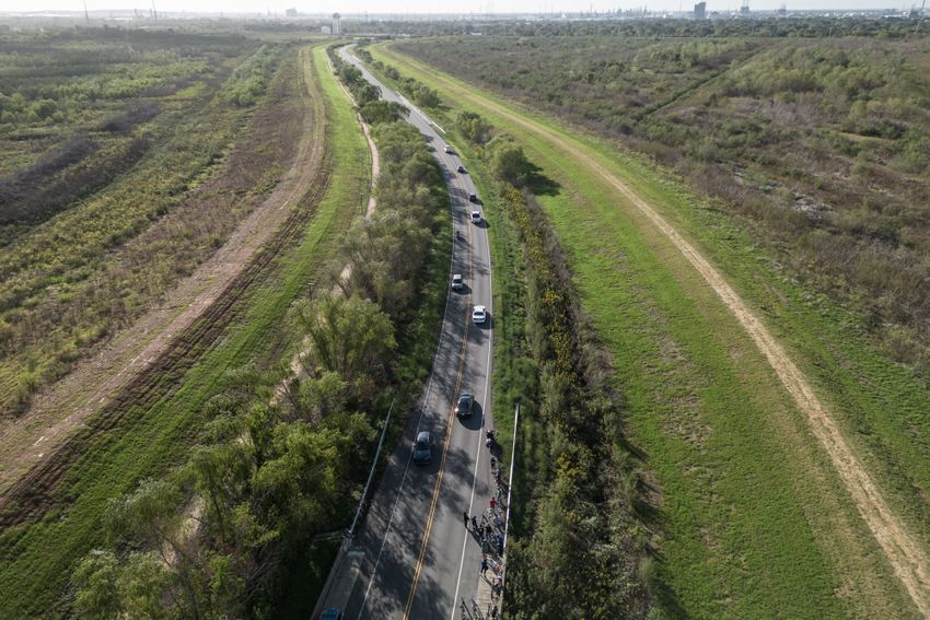 Participants of the bike ride make a stop on their tour at landfills created from dirt dredged during a ship channel expansion in the petrochemical corridor. There have been concerns about possible contaminants in the soil.  

Los participantes del recorrido en bicicleta hacen una parada en los vertederos creados a partir de la tierra dragada durante la ampliación del canal de navegación en el corredor petroquímico. Ha habido preocupación por posibles contaminantes en la tierra.

Participants of the bike ride event to raise awareness about air pollution, make a stop on the roadside in between the land fill sights which were made from dirt left during the ship channel expansion work on Saturday October 28, 2023 in Galena Park, TX