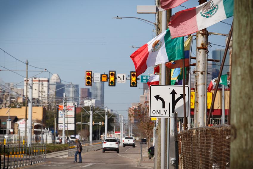Mexican flags wave along Harrisburg Ave. in Houston.