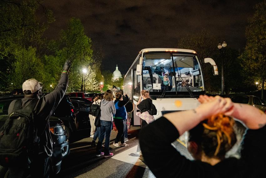 Union Station, Washington, DC - Activists line up to impede journalists from photographing as two buses of migrants arrive near Union Station as part of Gov. Greg Abbott’s new plan in response to the end of Title 42, a pandemic-era emergency health order to that allowed immigration authorities at the border to deny entry to migrants in Washington, DC, on Thursday, April 21, 2022.