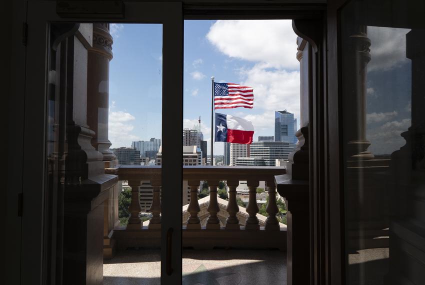 A view of the U.S. and Texas flags flown on the south side of the Texas Capitol from the Capitol Dome in Austin on Aug. 12, 2021.