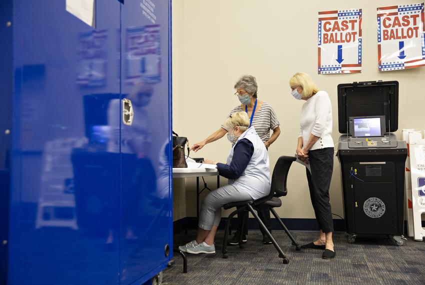 Connie Ford, middle, assists Ann Massey, left, and Linda Frageman, right, at a training lab at the Collin County Elections Department on June 23.