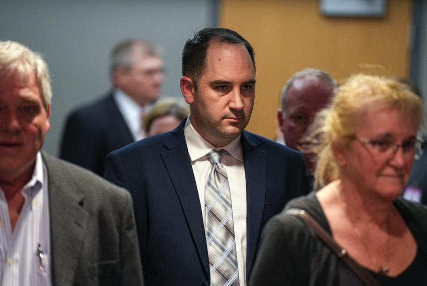 Daniel Perry and his family walk to the 147th District Courtroom at the Travis County Blackwell Thurman Criminal Justice Complex on Thursday Mar. 23, 2023 in Austin. Perry is on trial for shooting and killing protester Garrett Foster during the 2020 Black Lives Matter protests in Austin.