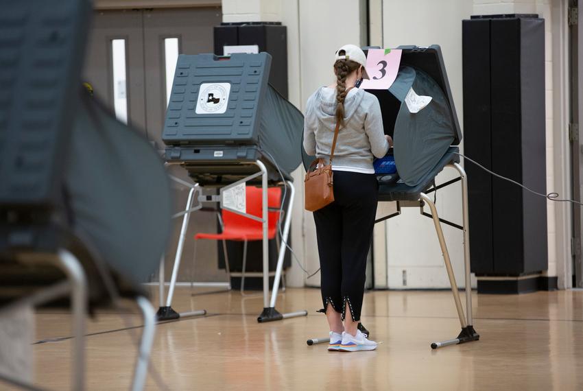 A voter casts her ballot at the Metropolitan Multi-Services Center during Election Day in Houston on Nov. 3, 2020.