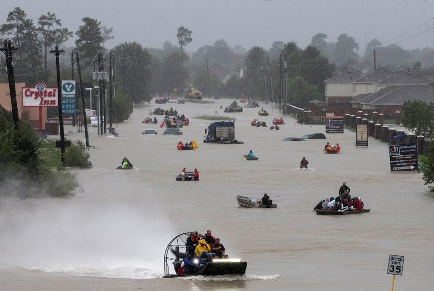 Residents used boats to evacuate floodwaters from Tropical Storm Harvey along Tidwell Road in Houston on Aug. 28, 2017.