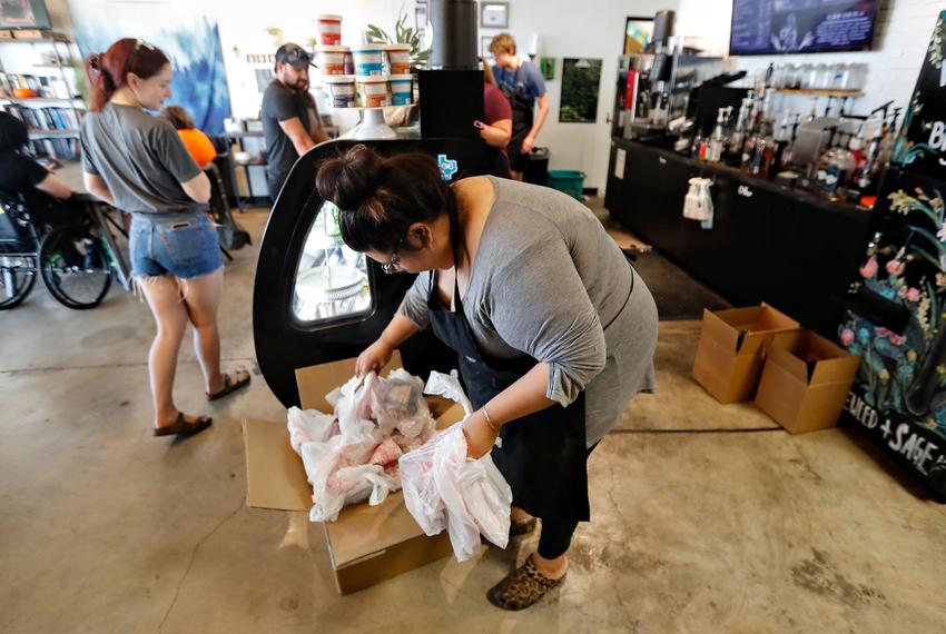 Destiny Adams unpacks newly received Plan B test kits in her Tumbleweed + Sage Coffee Shop in Wolfforth, TX. Adams keeps a stock of the test kits so her customers can easily find the tests.