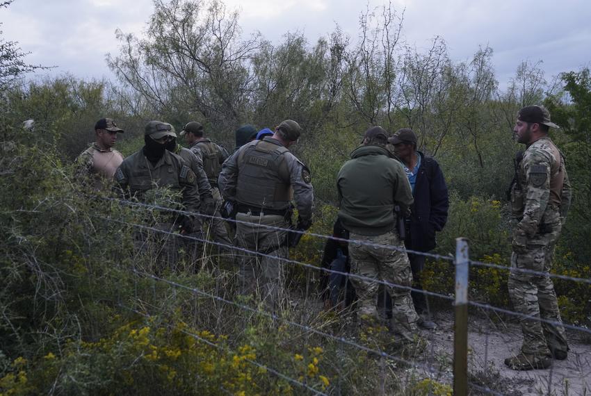 Department of Public Safety Special Operations agents escort a group of migrants through private property as part of Operation Lone Star after catching them in Kinney County near Brackettville, Texas on Nov. 9, 2021. The owner of the property did not sign the affidavit to allow DPS to arrest undocumented migrants in their property, so they will be processed by Border Patrol.
Verónica G. Cárdenas for ProPublica/The Texas Tribune
