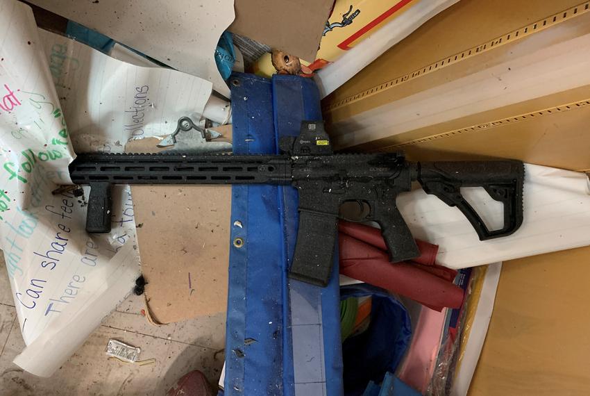 The gunman's AR-15 style rifle lays in a supply closet of Room 111 at Robb Elementary School.