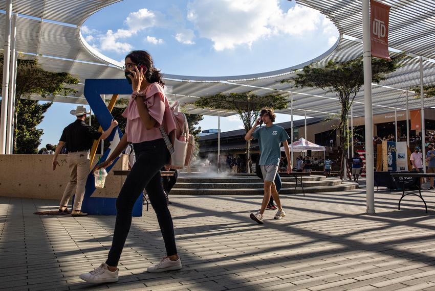 Students walk through campus at the University of Texas at Dallas on Aug. 27, 2021.